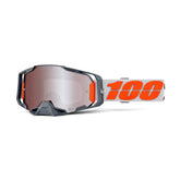 100% ARMEGA goggles on a dirt bike, angled view showing secure lens retention