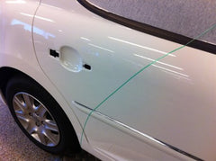 Door handle detailing with 3M finish line tape during wrap work