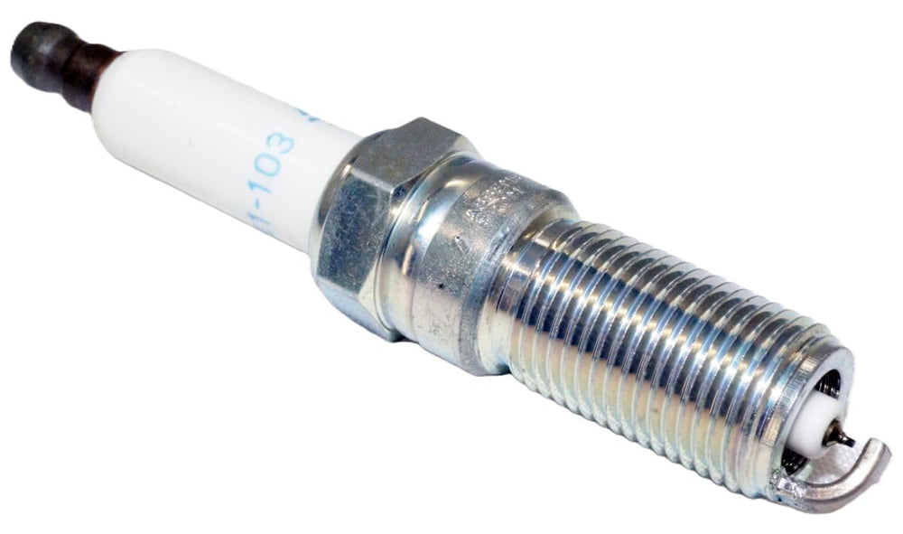 ACDelco spark plug terminal end close-up revealing robust electrode design.