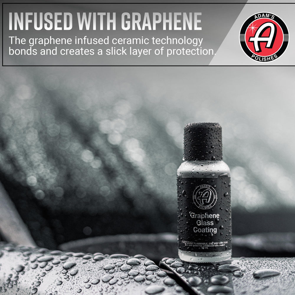 Adam's Polishes Graphene Glass Coating close-up shows coated glass with water beading and clarity