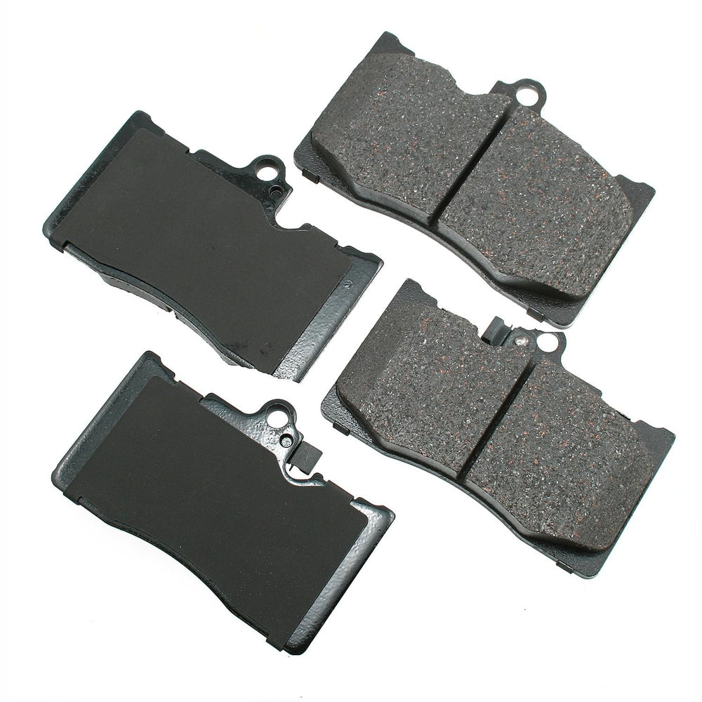 Akebono ProACT Ultra-Premium ceramic brake pads in grey, delivering quiet braking and low dust.