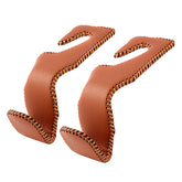 AMVOYOA purse hook for car with brown leather headrest hanger facilitates quick organization.