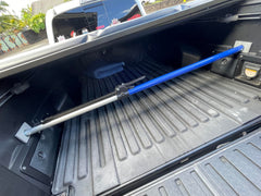 ANLU LOAD cargo bar used as a divider in a van for organized space