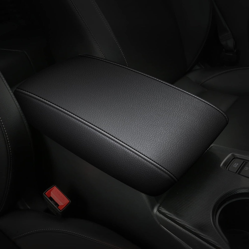 AOMSAZTO black armrest cover on Nissan Maxima center console protects surface.