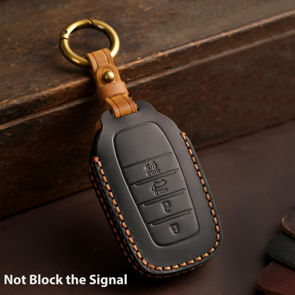 Aoocar black leather key fob cover on Toyota key demonstrates no screw design ease.