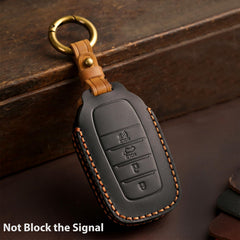 Aoocar black leather key fob cover on Toyota key demonstrates no screw design ease.