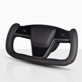 Aotoyou Tesla Yoke steering wheel cover installed, improves grip and comfort on daily drives.