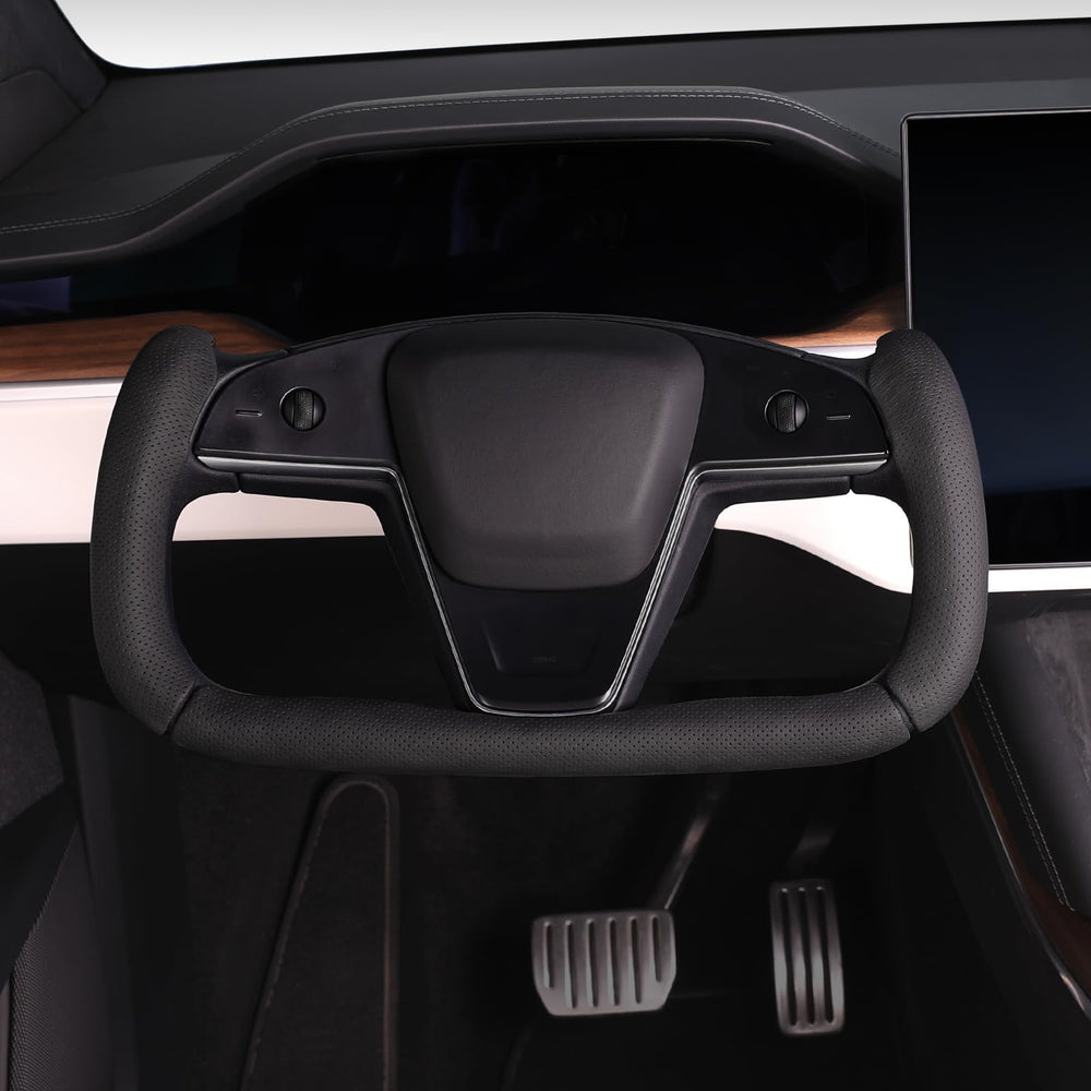 Close-up of the Aotoyou cover showing precise fit on the Tesla Yoke steering wheel.