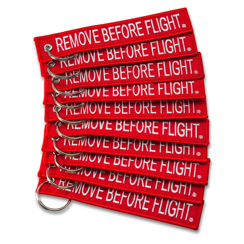 Apex Imports AIXEPA remove-before-flight keychain in red and white for travel reminders.