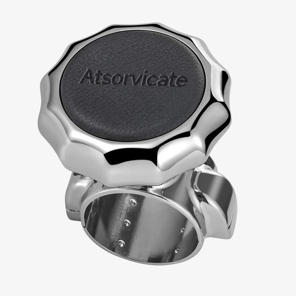 Atsorvicate steering wheel knob with metal body and cowhide grip for durable control.