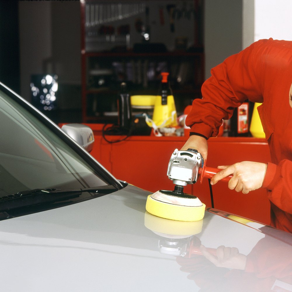 Augshy polishing pad kit in action during car detailing.