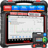 Autel MaxiCOM MK900 bidirectional scanner on desk for advanced diagnostics and testing.