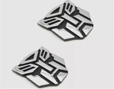 Autogem transforming robot emblem with chrome finish enhances exterior style.