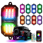 Auxbeam 8-pod RGB rock lights illuminate truck underglow vividly.