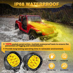Auxbeam P4 amber fog light on an off-road vehicle in dusty conditions.