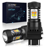 AUXITO 3157 switchback amber turn signal bulb showing bright amber signaling for safer lane changes.