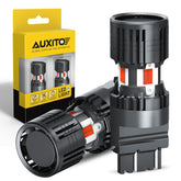 AUXITO CANBUS 3157 red LED bulb installed in car for high visibility