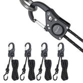 Ayaport rope tie-down ratchet with carabiner clip securing gear on a roof rack