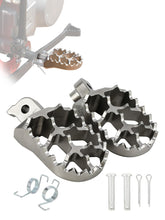 BAOUFF dirt bike foot pegs with springs provide secure grip on rough trails.