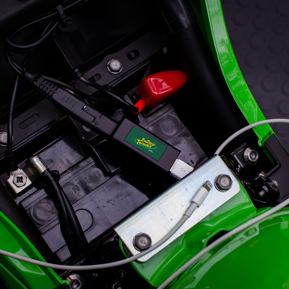 Battery Tender adapter side connection showing SAE quick disconnect for 12V charging.