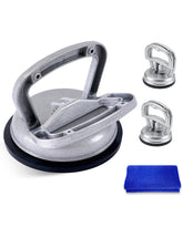 BeautyBeam large suction cup in use on a car door for dent removal.