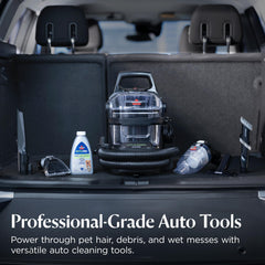 Pet hair remover attachment lifting fur from car upholstery on BISSELL Little Green Auto Pro