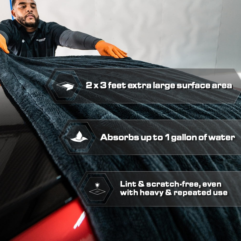 Blackline drying towel gliding across a car surface without scratches