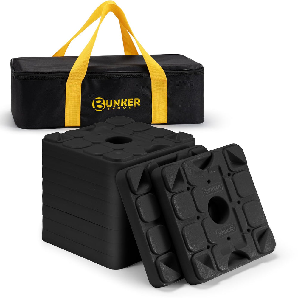 BUNKER INDUST RV leveling blocks with interlocking pads stabilizing uneven ground for a level campsite