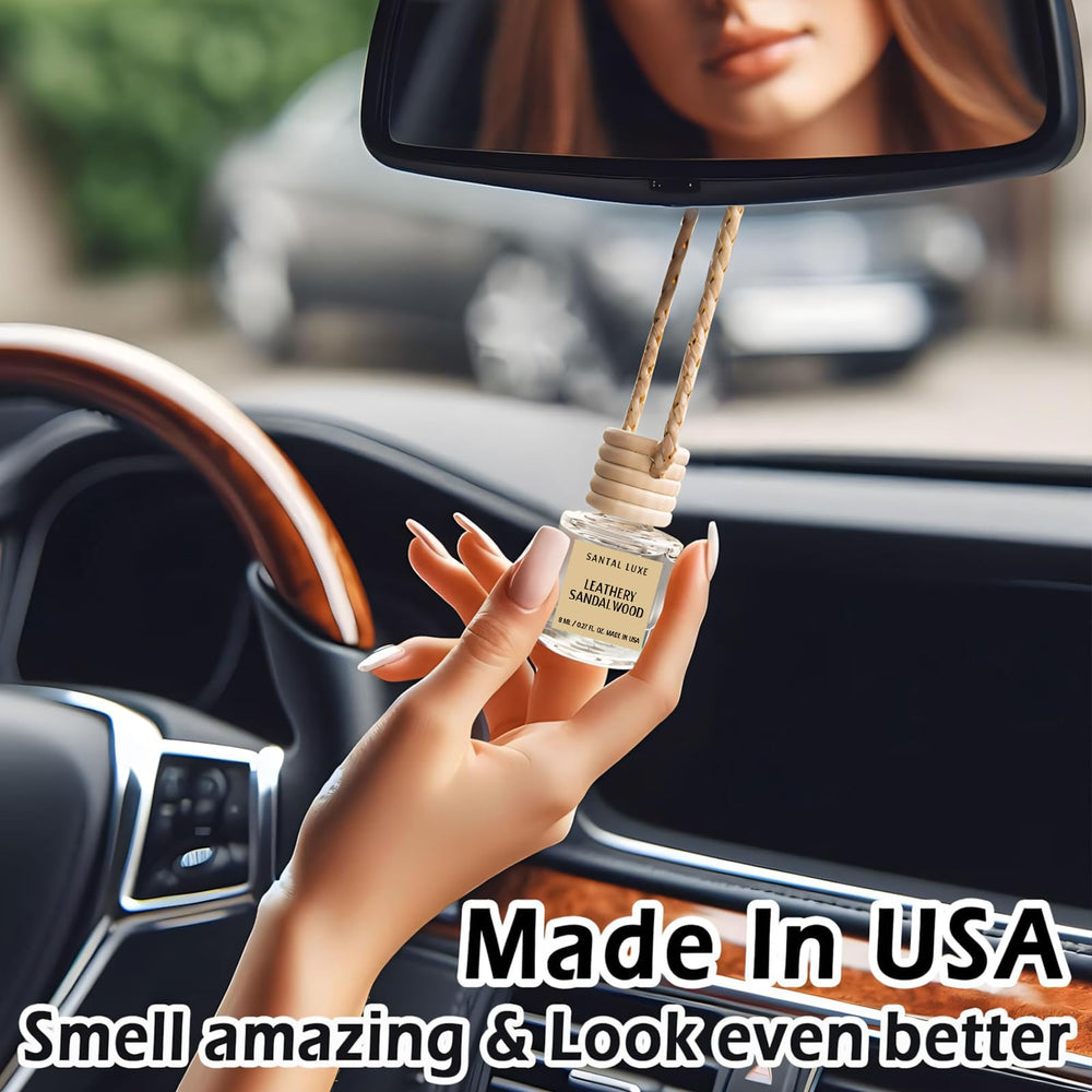 C Classy USA-made air freshener features wood hanger and thick glass bottle.