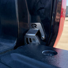 Cali Raised LED bracket installation shows bolt-on fit without drilling.