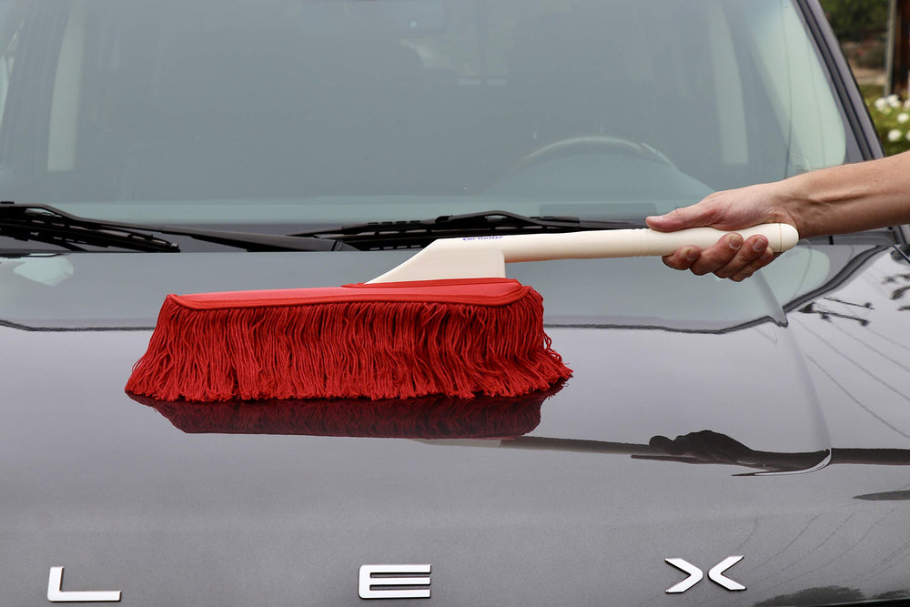 Wax-treated mop on California Car Duster lifts dust without rubbing.
