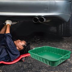 CALLARON pan being emptied into a container after an oil change.
