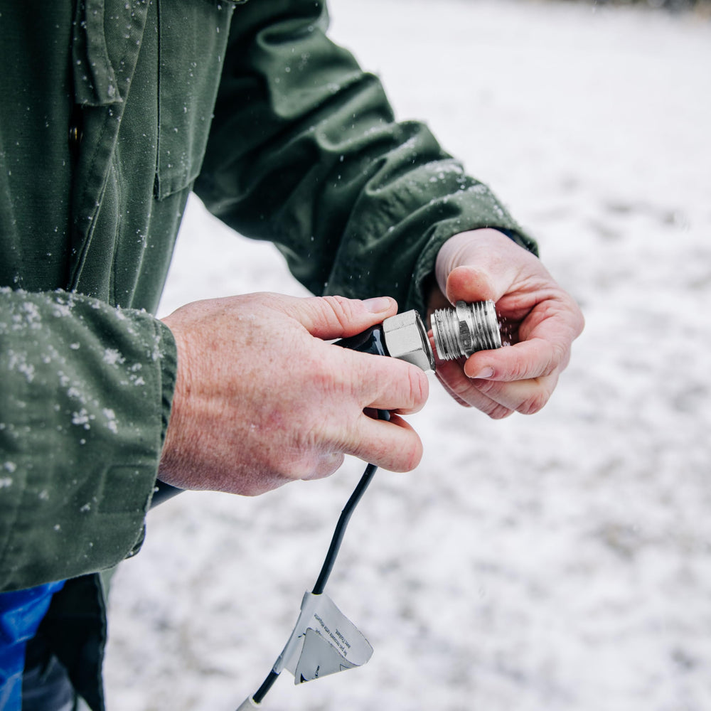 Camco compact hose setup for easy storage and quick connection.
