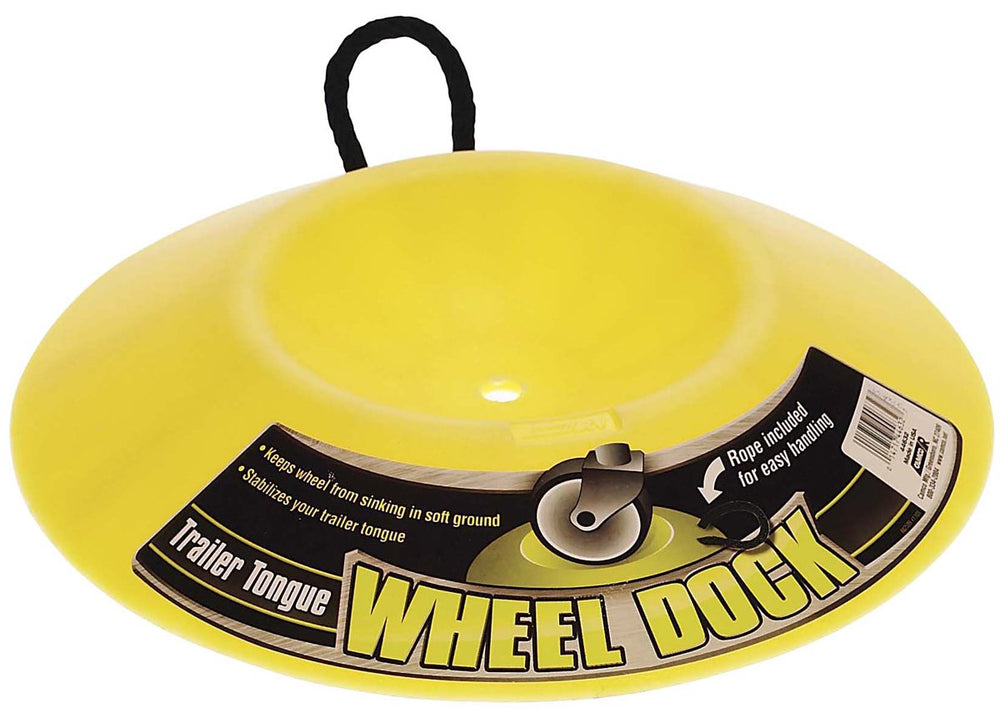 Camco heavy-duty wheel dock in use stabilizing a trailer wheel on soft ground