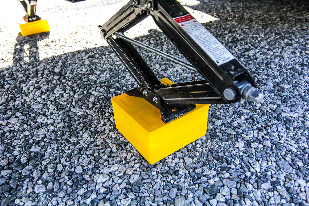 Camco leveling block cap used as a jack pad for stabilizers.