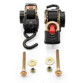 Camco retractable transom tie down strap mounted on trailer for secure travel.