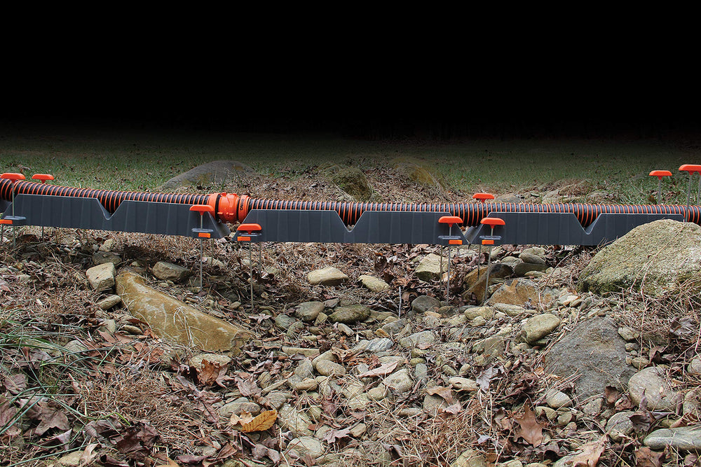 Camco Rhino stakes secure the unit on soil or concrete surfaces