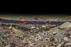 Camco Rhino stakes secure the unit on soil or concrete surfaces