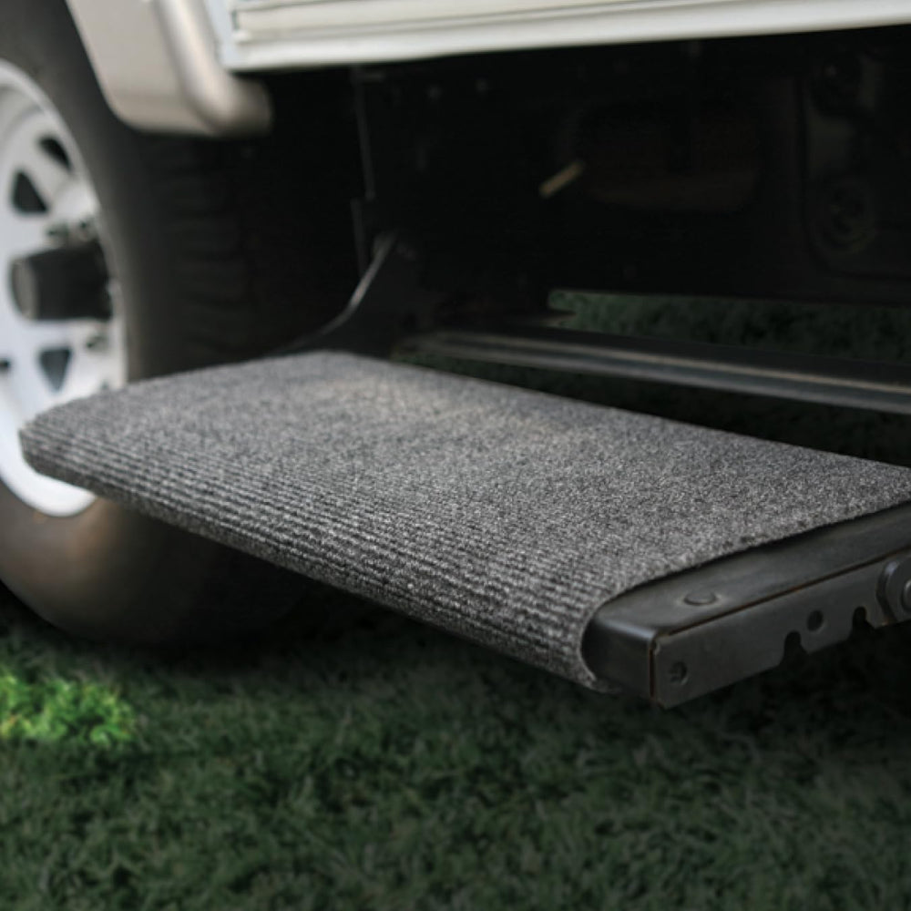 Camco step rug installation side view shows no tools required for easy setup.
