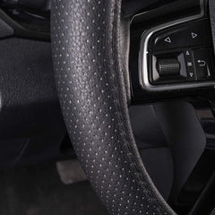 CAR PASS Classic Leather steering wheel cover provides heat and cold protection for hands.