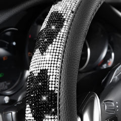 Close-up of luxury cow-print rhinestones on CAR PASS steering wheel cover.