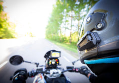 Cardo PACKTALK PRO DMC intercom connects up to 15 riders for group chats.