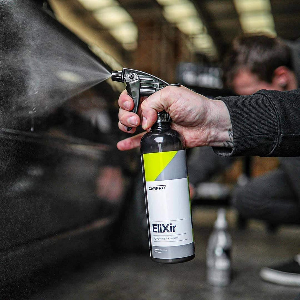 CARPRO Elixir spray application in progress on a panel