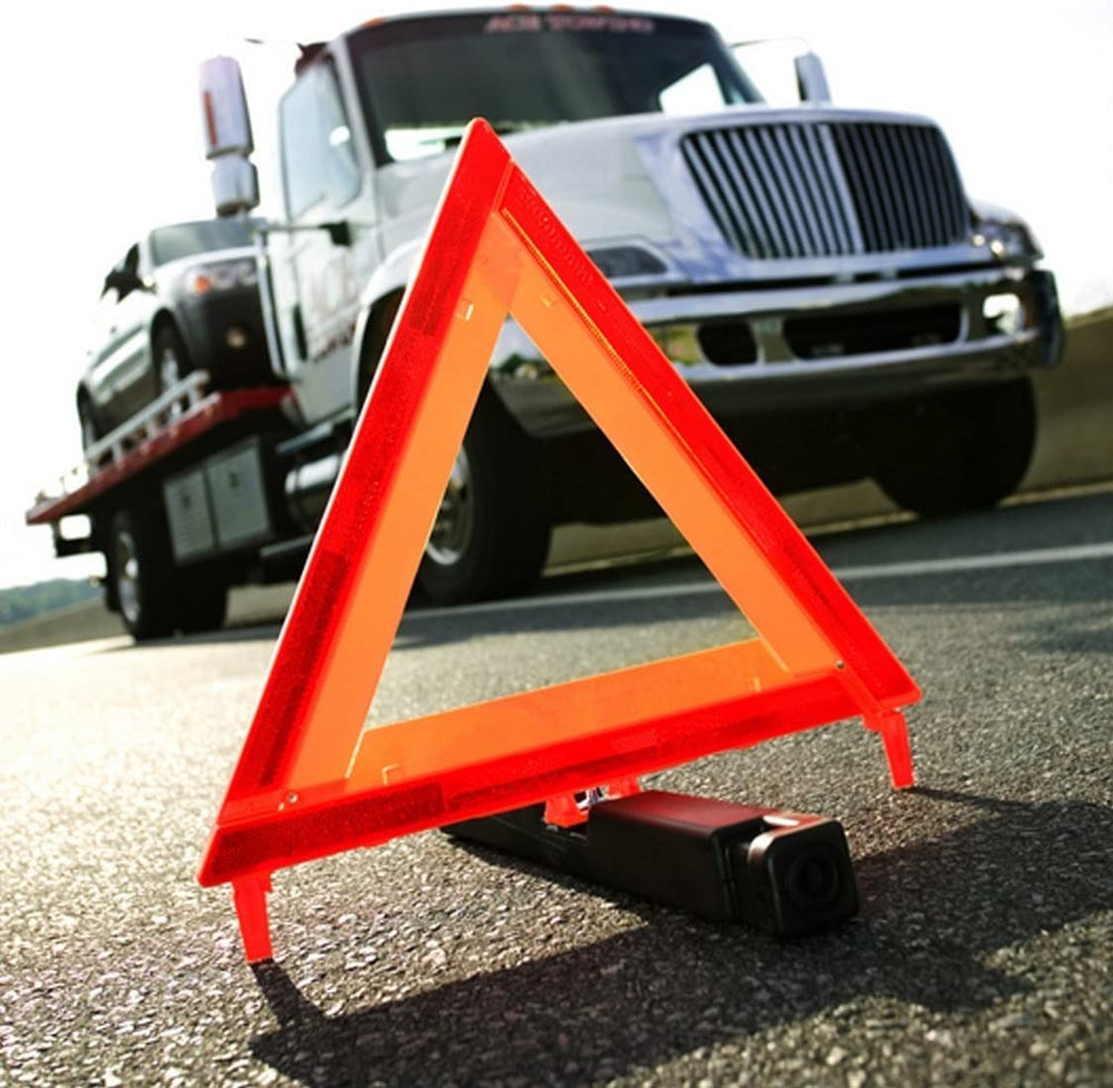 CARTMAN emergency triangle reflective panel close-up highlights high visibility at night.