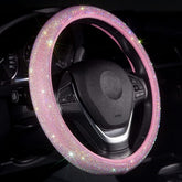 Carwales pink bling steering wheel cover with rhinestones adds feminine style and grip.