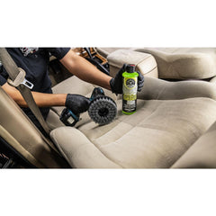 Spinner brush in car interior, reaching seats and fabrics with ease.