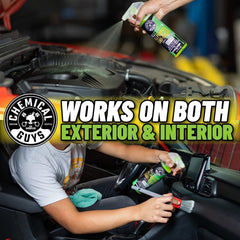 Applying Chemical Guys All Clean+ Citrus spray to dashboard for quick interior cleaning