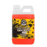 Chemical Guys Bug & Tar Wash bottle pour demonstrating precise dilution for efficient pre-wash