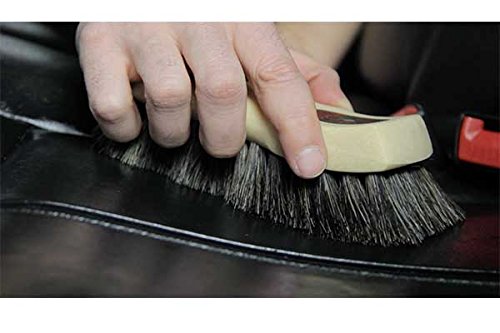 Horsehair brush reaches seams for deep leather cleaning with Chemical Guys.