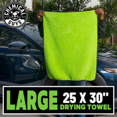 Large 25x30 inch towel covers wide panels for efficient drying on a vehicle.